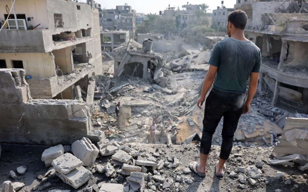 A Palestinian man stares at the rubble of the Alloush family's house, levelled in an Israeli strike in Jabalia in the northern Gaza Strip on November 10, 2024.