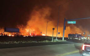 In this image obtained from the County of Maui in Hawaii, shows a wildfire in Lahaina, on 9 August, 2023. Hawaii wildfires fanned by winds from Hurricane Dora forced evacuation late on 8 August.