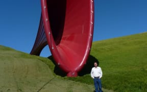 Martin Lodge at The Farm sculpture park, Kaipara Harbour, with Dismemberment 1 by Anish Kapoor, 2011