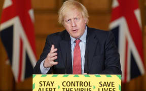 A handout image released by 10 Downing Street, shows Britain's Prime Minister Boris Johnson attending a remote press conference to update the nation on the COVID-19 pandemic.