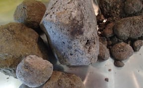 Work is being to determine if this pumice came from a volcano on the Kermadac Arc, and if it might have washed ashore during a tsunami about 2000 years ago.