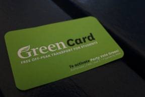 Green Party pledge card for free off-peak transport.