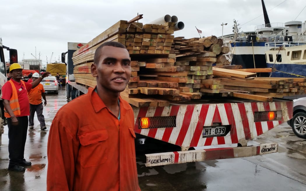 Leo at the Walu Bay wharf works long hours to load ships.