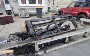 A burnt out couch on Cumberland Street (SH1) in Dunedin.