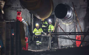 Geotechnical engineer Chris Lee, Mine Deputy Kirk Neilson and Chief Operating Officer Dinghy Pattinson opening the doors to the mine.
