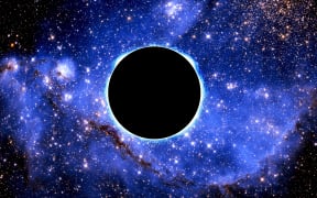 Black hole, illustration. (Photo by VICTOR de SCHWANBERG/SCIENCE PHO / VSC / Science Photo Library via AFP)
