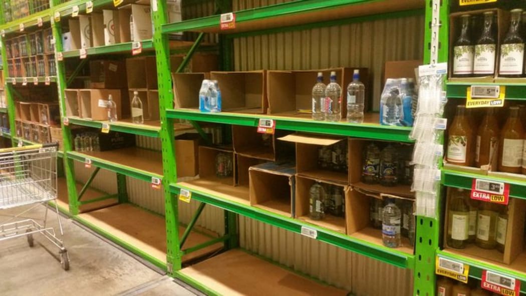 Empty water bottle shelves in Napier