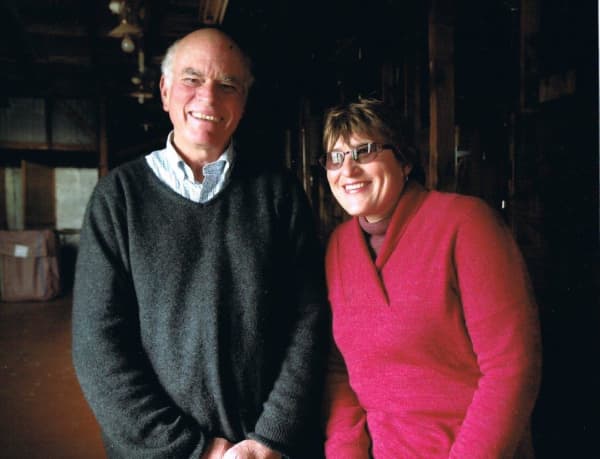 John and Yvonne Harvey, standing inside the old woolshed at Daisybank Farm.