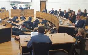 The Extinction Rebellion demonstration at Christchurch City Council during a meeting this morning.