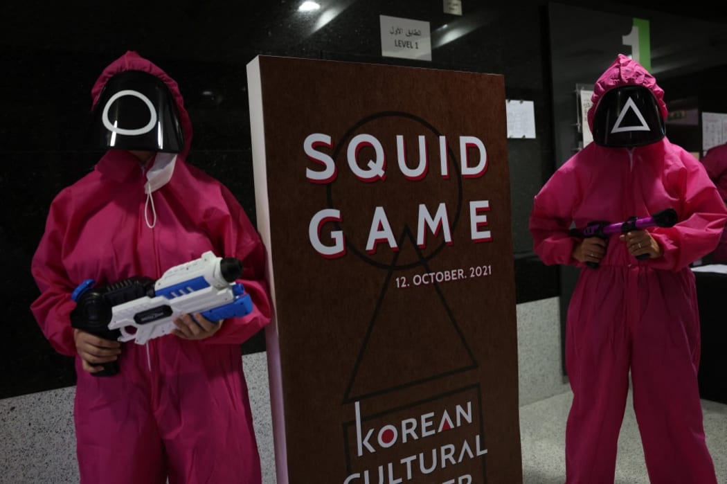 Participants take part in an event where they play the games of Netflix smash hit "Squid Game" at the Korean Cultural Centre in Abu Dhabi, on October 12, 2021.