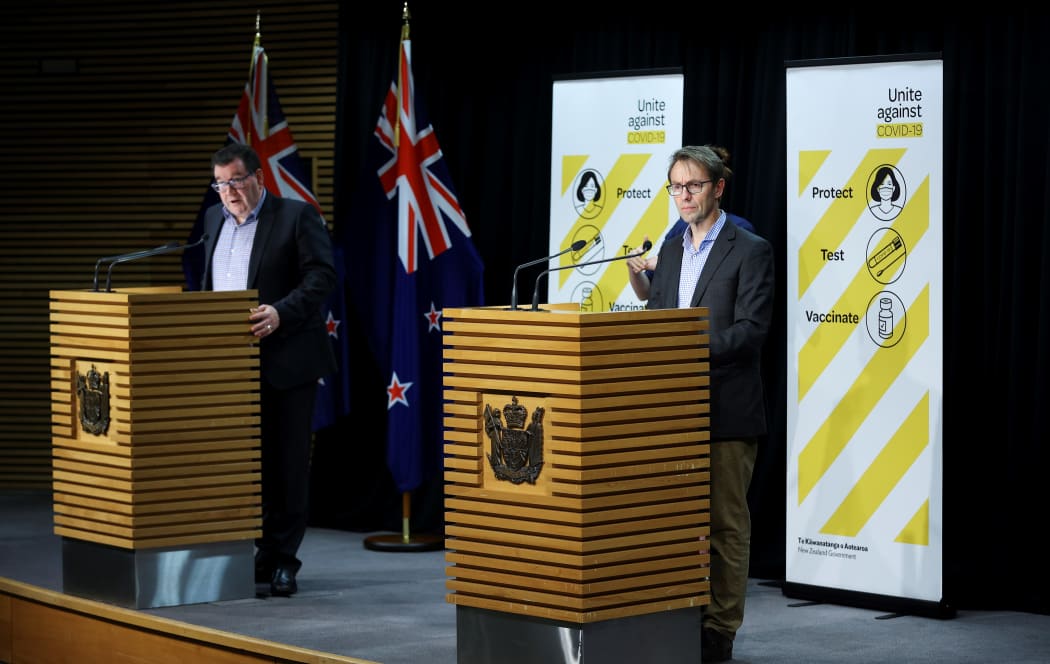 WELLINGTON, NEW ZEALAND - SEPTEMBER 05: Deputy Prime Minister Grant Robertson (L) and Director-General of Health Dr Ashley Bloomfield address media during a press conference at Parliament on September 05, 2021 in Wellington,