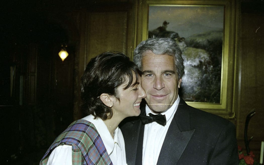 This undated trial evidence image obtained 8 December 2021, from the US District Court for the Southern District of New York shows British socialite Ghislaine Maxwell and US financier Jeffrey Epstein.