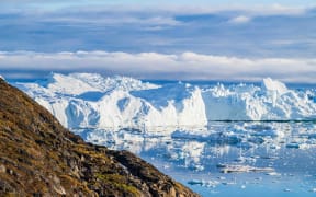 The Ilulissat Icefjord, also known as Sermeq Kujalleq, is draining approximately 7% of Greenland's ice sheet in Ilulissat, Greenland, on July 3, 2024. This glacier, the largest outside of Antarctica, is calving enough ice daily to meet New York City's water needs for an entire year. In recent decades, the glacier is moving at unprecedented speeds, reaching up to 40 meters per day, a significant increase from the 19 meters per day recorded prior to 2002. Since 1850, the glacier is retreating a staggering 40 kilometers, a retreat attributed to the alarming effects of human-induced climate change. Over the past 60 years, Greenland is experiencing a temperature rise of 9 degrees Fahrenheit, contributing to the glacier's rapid recession.