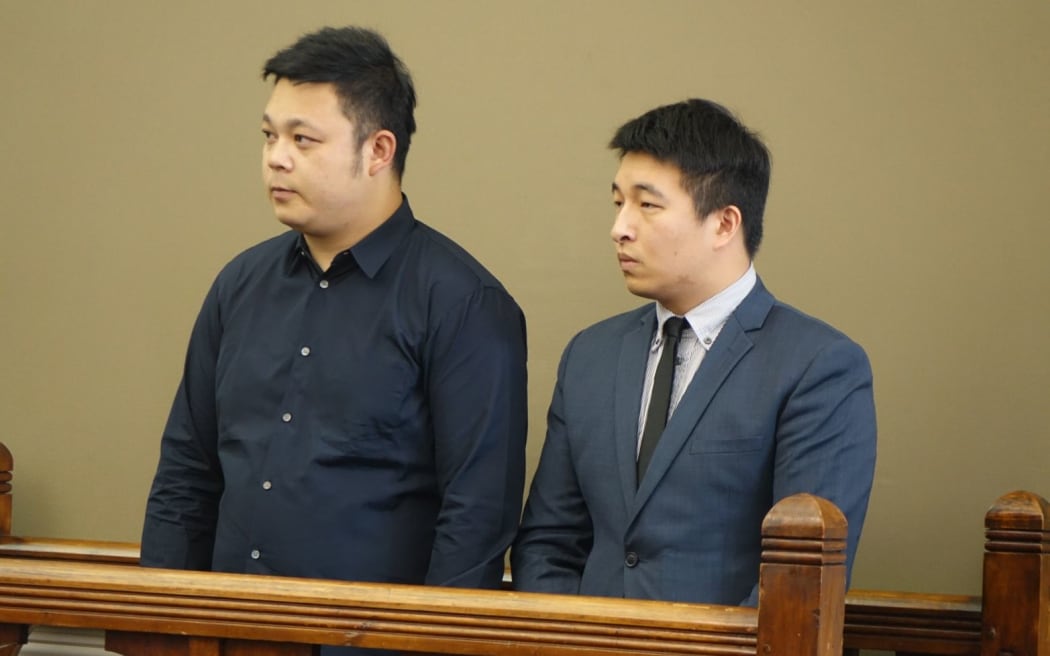 Chinese tourist Jing Cao. Charged with the death of a five-year-old Oamaru girl. Court appearance 13 March 2015. Solicitor Kane Wang (right) who was there to interpret.