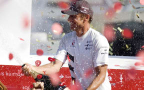 Ernesto Bertarelli celebrates winning the America's Cup in 2003.