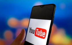 An illustration photo shows the YouTube logo displayed on a smartphone in Suqian, China, on March 6, 2025. (Photo Illustration by Costfoto/NurPhoto) (Photo by CFOTO / NurPhoto / NurPhoto via AFP)