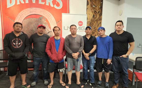First Union's organiser Mikee Santos (far right) represents a group of a group of Filipino construction workers, who say their former employer Rehua Reo Contracting owe them weeks' worth of wages.