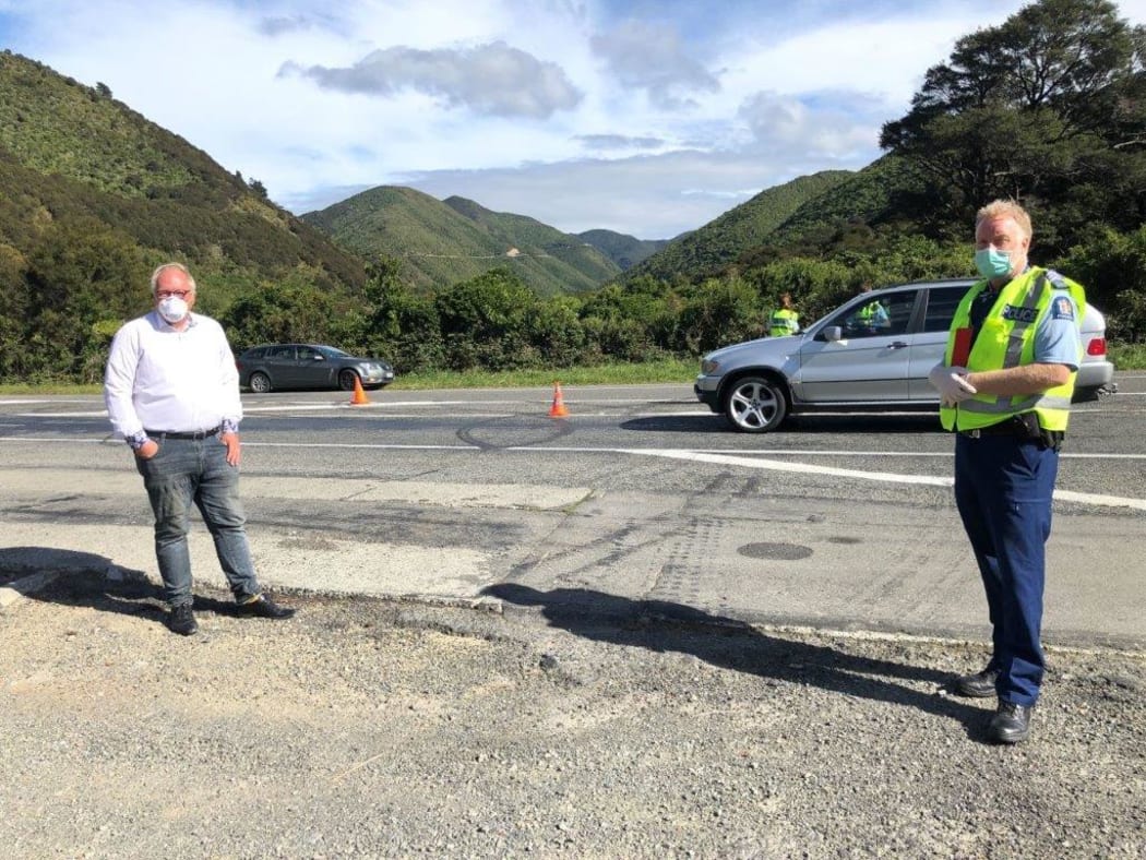 South Wairarapa Mayor Alex Beijen with Detective Sergeant Mike Smith at a police checkpoint near Featherston.