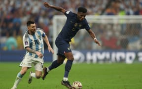 Argentina's forward #10 Lionel Messi (L) fights for the ball with France's midfielder #08 Aurelien Tchouameni (R) during the Qatar 2022 World Cup final football match between Argentina and France at Lusail Stadium in Lusail, north of Doha on 18 December 2022.