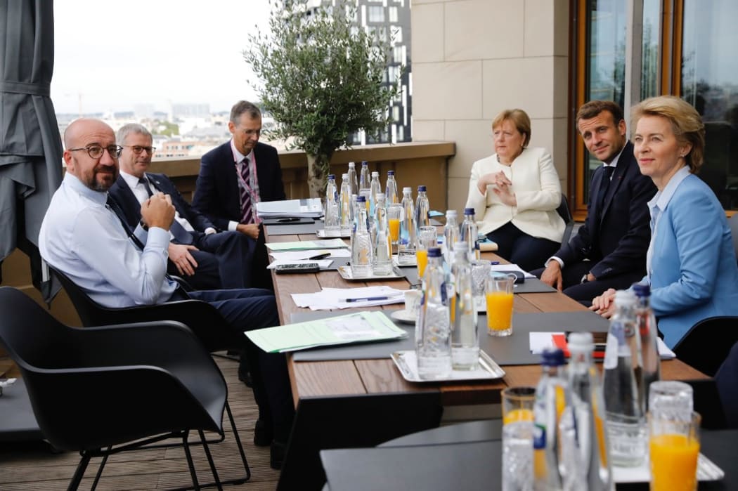 German Chancellor Angela Merkel (3rd R),  European Commission President Ursula von der Leyen (R), President of European Council Charles Michel (L) and French President Emmanuel Macron (2nd R) meet within the EU Leaders Summit in Brussels, Belgium on July 19, 2020.