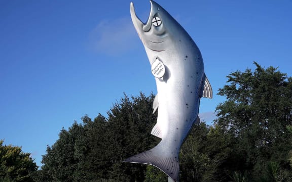 Greenpeace Aotearoa says its activists "altered" the Rakaia salmon statue, turning it into a cartoon dead fish in protest of the dairy industry's environmental destruction, but the council says it was vandalised.