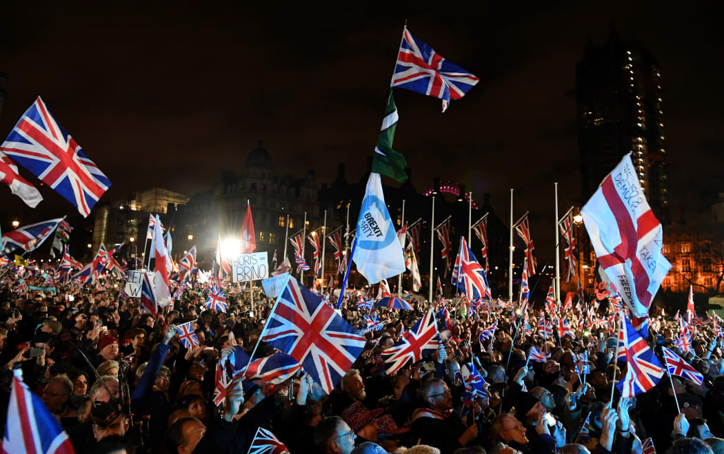 Brexit supporters wave Union flags as they gathered in Parliament Square.