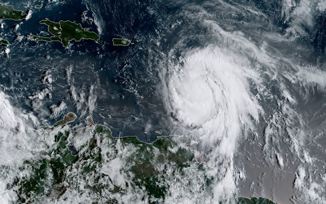 A satellite image from the US National Oceanic and Atmospheric Administration shows Hurricane Maria on 18 September.