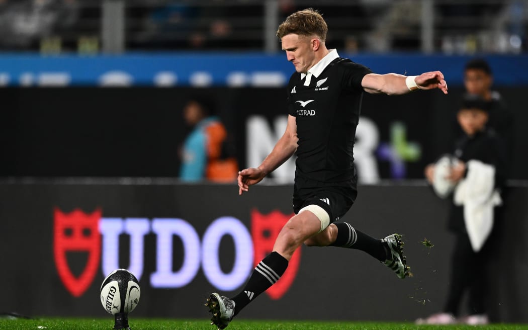 New Zealand’s Damian McKenzie kicks a conversion.