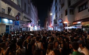 Music enthusiasts gather in the streets during France's annual street music festival, the Fete de la Musique, in Paris, France, on June 21, 2025. (Photo by Jerome Gilles/NurPhoto) (Photo by Jerome Gilles / NurPhoto via AFP)