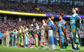 Performers in kimonos stand on the pitch of the Tokyo Stadium in Tokyo ahead of the Pool A opening match of the Japan 2019 Rugby World Cup between Japan and Russia on September 20, 2019. (Photo by Toshifumi KITAMURA / AFP)