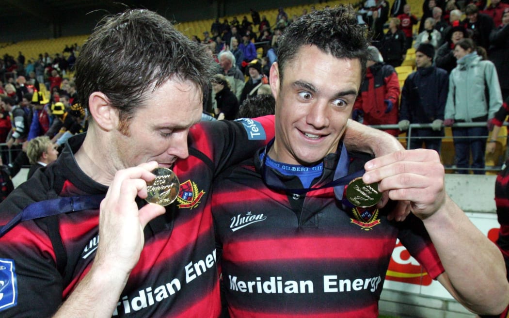 Canterbury's Andrew Merhtens and Daniel Carter after the 2004 NPC Final.