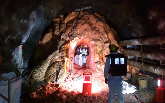 PRRA workers measuring the tunnel.