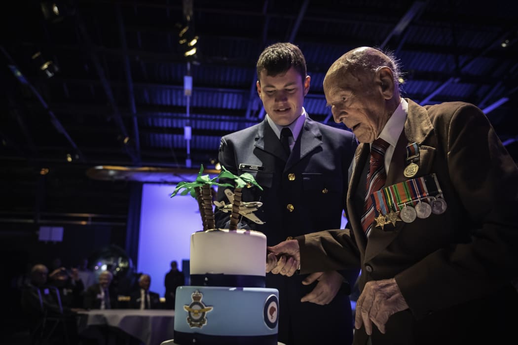 Ron Hermanns cutting his 108th birthday cake with help from the youngest serving airman in the RNZAF at the time, Aircraftman Hamish Batchelor (then 18).