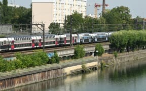 (FILES) This photograph taken in Choisy-le-Roi, on the outskirts of Paris, on 14 August, 2025 shows the Seine river where firefighters were called to pulled out four men's bodies from the river on August 13, 2025, after an alert was raised by a passenger travelling on the RER C train, who reported seeing a body floating in the Seine, according to police sources.