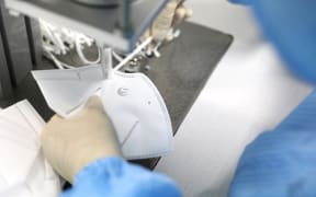A worker produces medical N95 masks at a mask production company in Shenyang, China, on February 8, 2020.