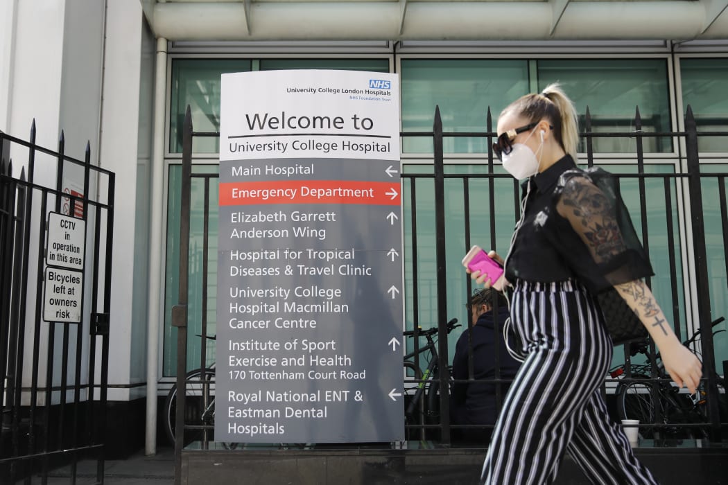 A pedestrian outside University College Hospital in London, where the coronavirus is being researched.