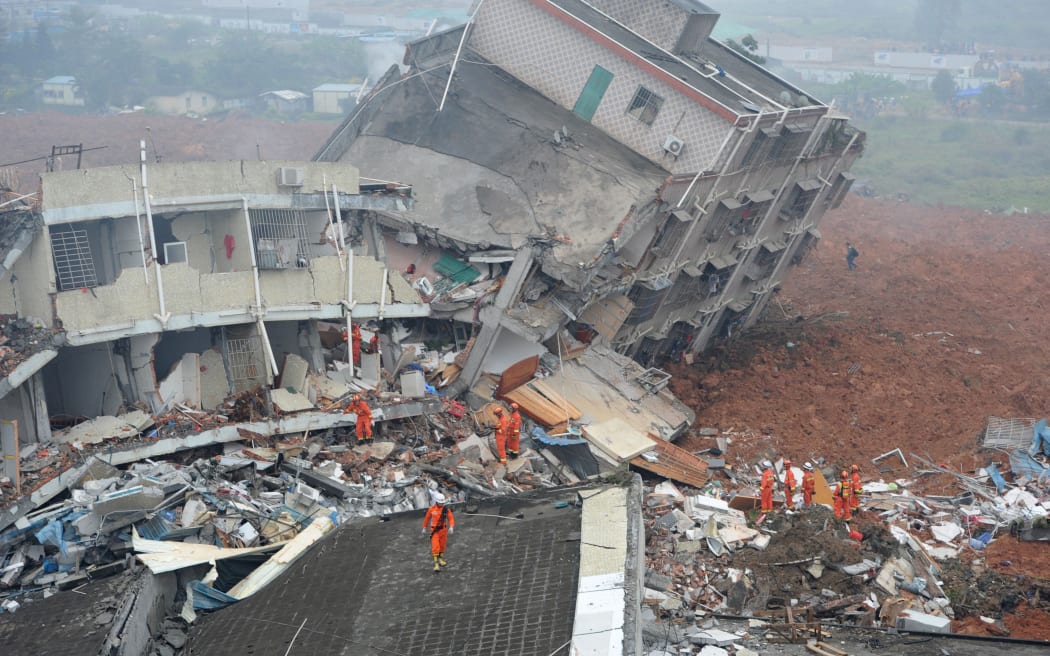 Rescuers hunt for survivors after a landslide flattened buildings in Shenzhen, in south China's Guangdong province.