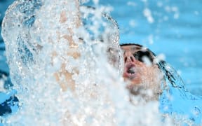 New Zealand's Kane Follows competes in a heat of the men's 200m backstroke swimming event during the Paris 2024 Olympic Games at the Paris La Defense Arena in Nanterre, west of Paris, on July 31, 2024. (Photo by Jonathan NACKSTRAND / AFP)