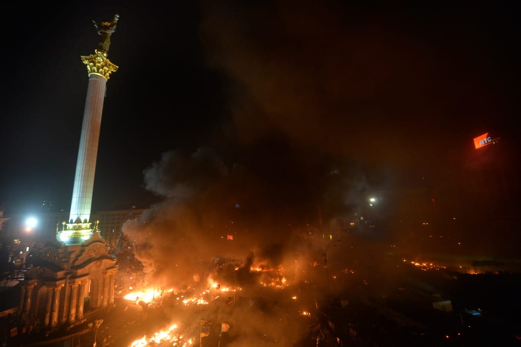 Flames engulf the protest camp in Independence Square.