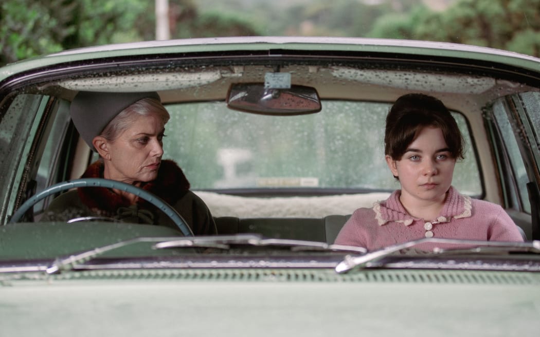 Philippa (Claire Walrdon) and Mary (Maya Le Roux) talk in the car outside the family home.