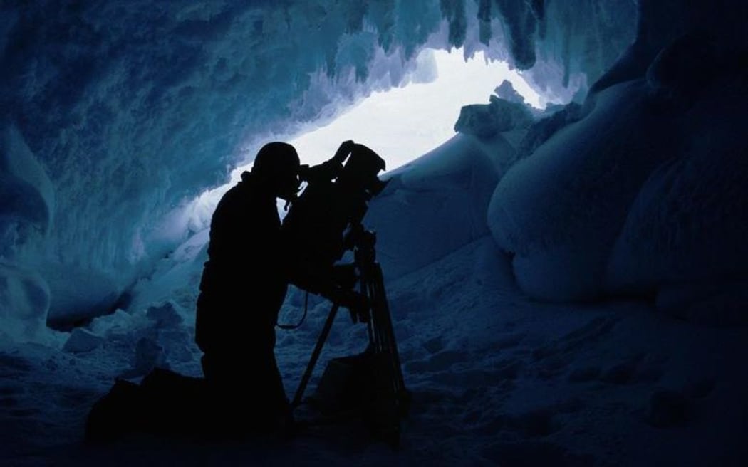 Max Quinn filming in the Erebus Glacier Tongue Ice Caves.