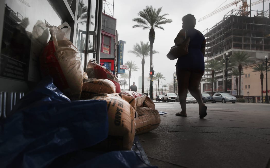 Sandbags are piled outside of a store in anticipation of Tropical Storm Barry.