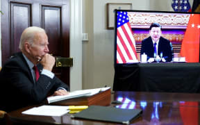 (FILES) In this file photo taken on November 15, 2021 US President Joe Biden meets with China's President Xi Jinping during a virtual summit from the Roosevelt Room of the White House in Washington, DC.