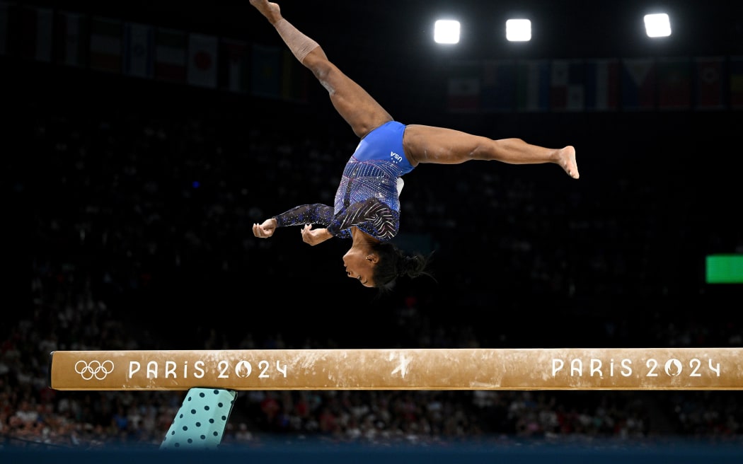 Simone Biles competes during qualifying for the balance beam at the Paris Olympics.