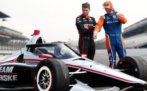 Scott Dixon (right) and Will Power look over the new aeroscreen which is being introduced for all Indycars.