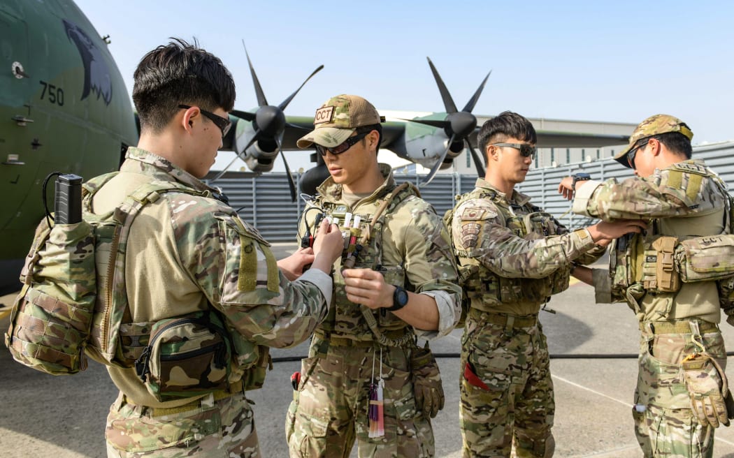 Combat Control Team members of the South Korean Air Force 5th Air Mobility Wing preparing to depart for Sudan at an undisclosed location in South Korea on 21 April, 2023. - Seoul said on April 21, it would send a military aircraft and soldiers to evacuate South Korean nationals stranded in Sudan.