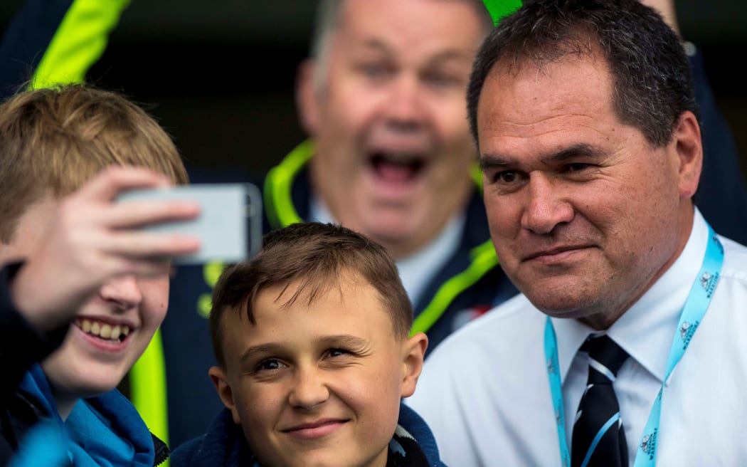Glasgow Warriors' coach Dave Rennie poses for a picture with fans.