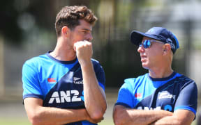 New Zealand player Mitchell Santner and head coach Gary Stead