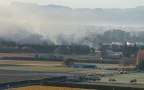Former council chair Rex Graham claims this photo shows smoke from orchard burnoffs over the Heretaunga Plains, but the council denies that.