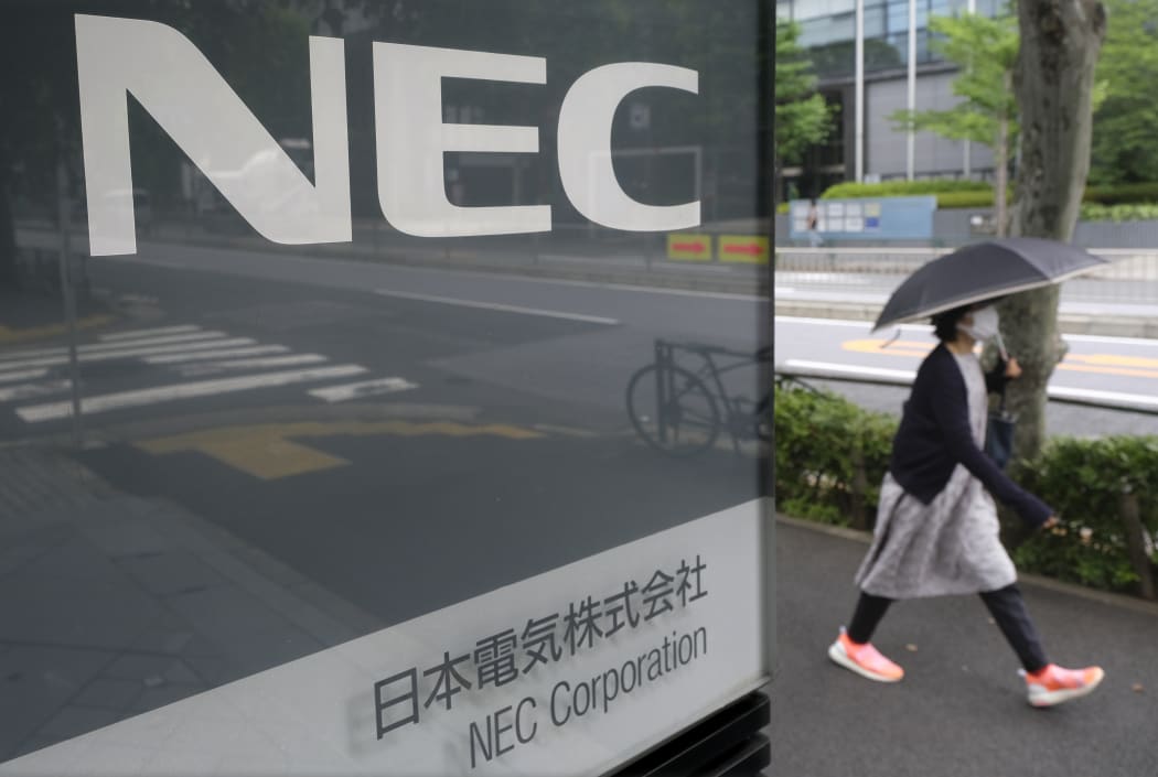The logo of Japanese information technology company NEC at their headquarters in Tokyo.